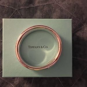 Tiffany silver bracelet. This is too small for my wrist. Serious injuries only.